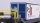 BEMO 2289 161 - RhB Sbk-v 7701 Containertragwagen 4-achsig, dunkelgrau - Beladung Schiebeplanen-Wechselbehälter "gasser BAUMATERIALIEN" blau/weiss